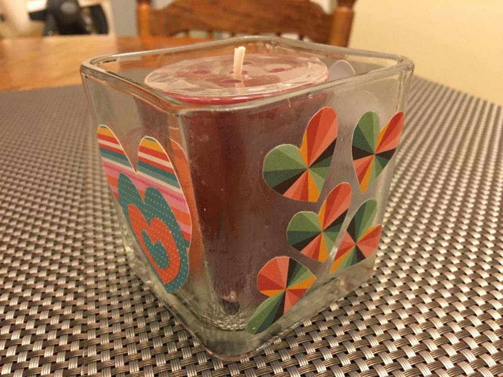 Mod podge candle holder with cardstock paper cut-outs.
